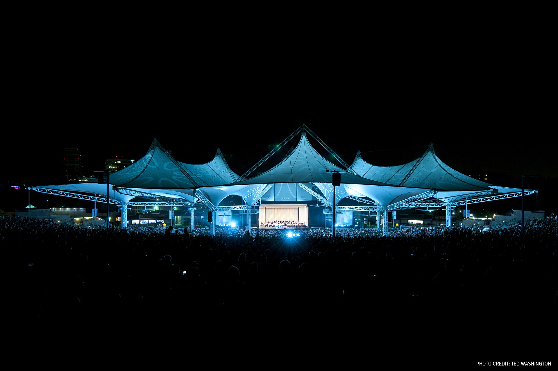 The Cynthia Woods Mitchell Pavilion illuminated during the Star-Spangled Salute